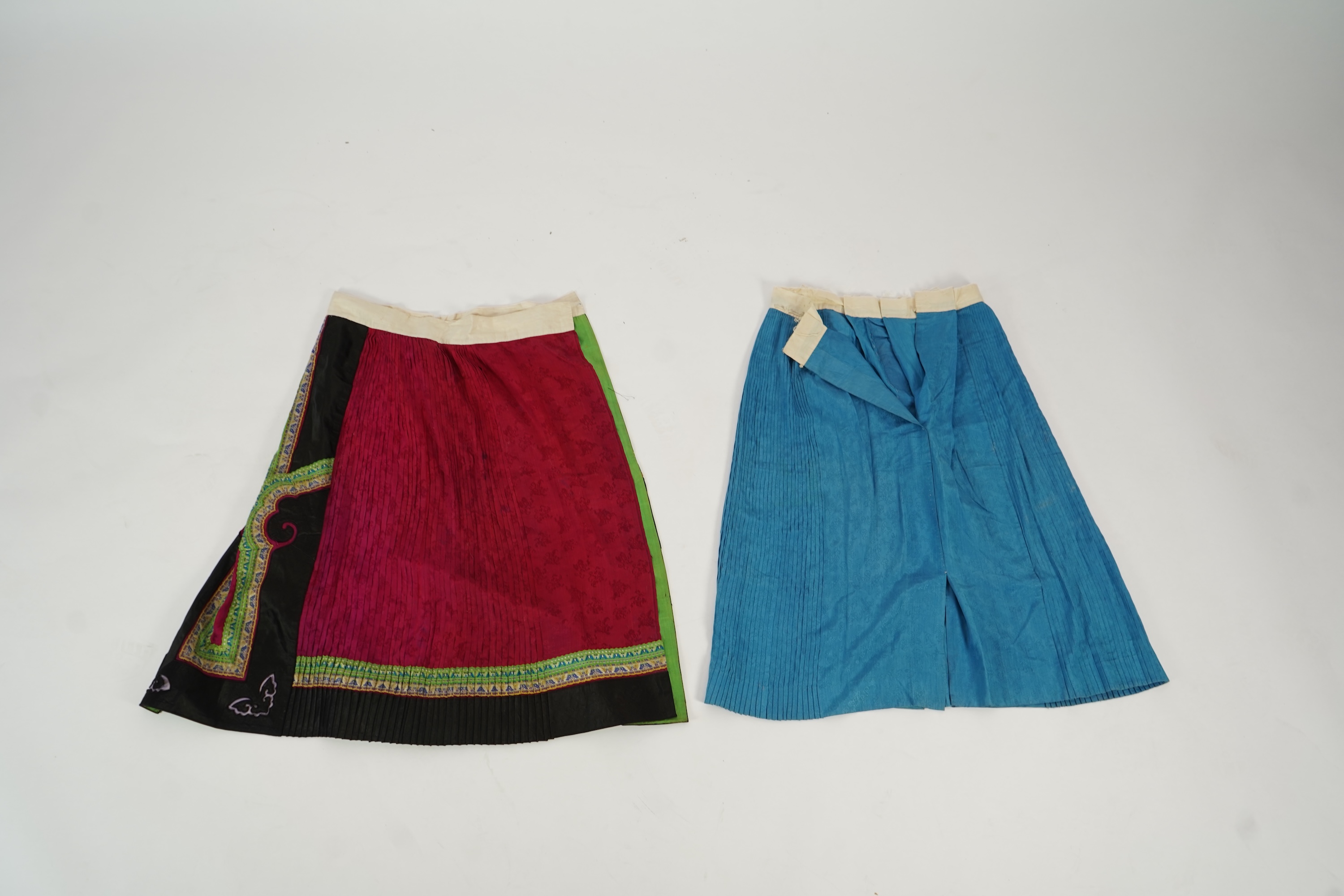 Two Chinese embroidered silk wedding skirts, late Qing, five hats, trousers, two skirt panels and two others, collar and a panel